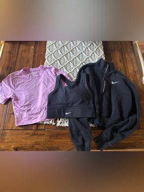 Women’s Nike Lot - crop top, sports bra and quarter zip sweatshirt.